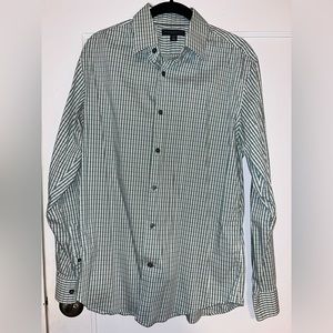 Green button up shirt.